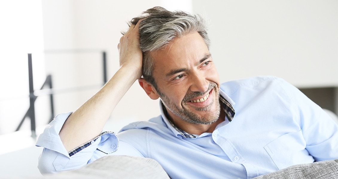 Handsome man with full head of hair.